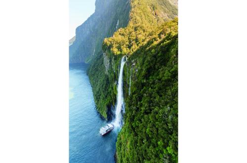 Milford Sound Nature Cruise getting close to the Stirling Falls waterfall